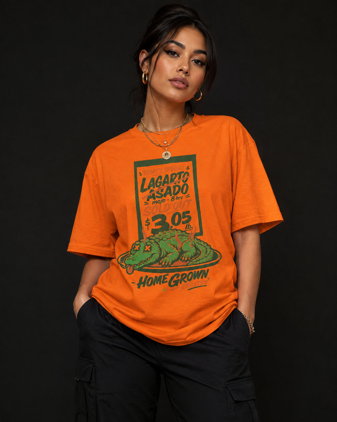 Model wearing the orange Lagarto Asado tee